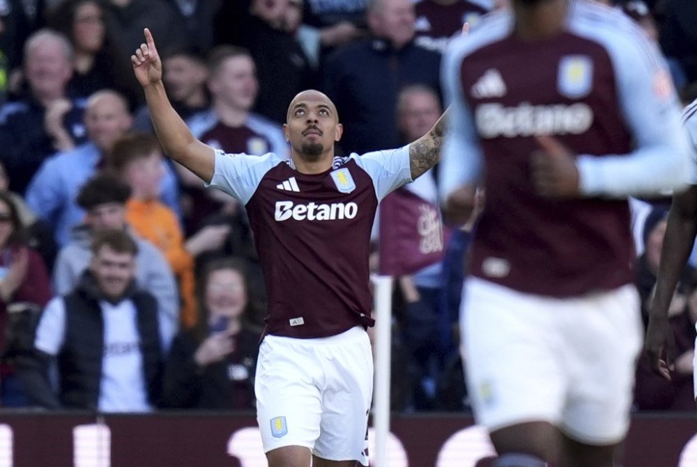Aston Villa's Donyell Malen celebrates after scoring his side's second goal during the English Premier League soccer match between Aston Villa and Nottingham Forest, at Villa Park, Birmingham, England, Saturday April 5, 2025. (Jacob King/PA via AP)