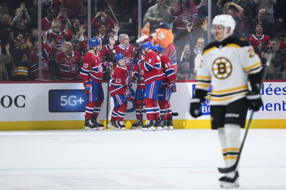 Montreal Canadiens right wing Cole Caufield (13) celebrates with teammates after scoring during second period NHL hockey action against the Boston Bruins in Montreal, on Thursday, April 3, 2025. THE CANADIAN PRESS/Christopher Katsarov