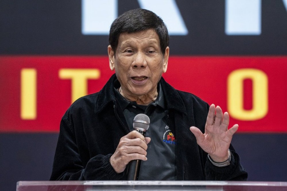 FILE - Former President of the Philippines Rodrigo Duterte speaks inside the Southorn Stadium during a thanksgiving gathering organized by Hong Kong-based Filipino workers for the former populist president in Hong Kong on March 9, 2025. (AP Photo/Vernon Yuen, File)