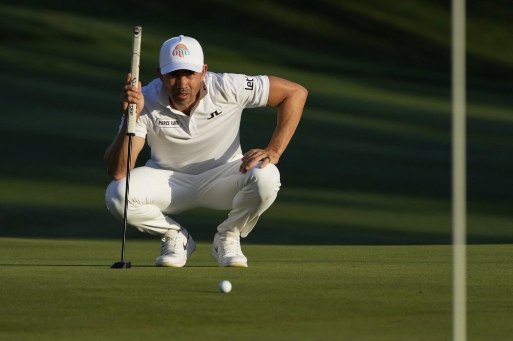 Camilo Villegas lines up a putt on the ninth green during the first round of The Players Championship golf tournament Thursday, March 13, 2025, in Ponte Vedra Beach, Fla. (AP Photo/Julia Demaree Nikhinson)