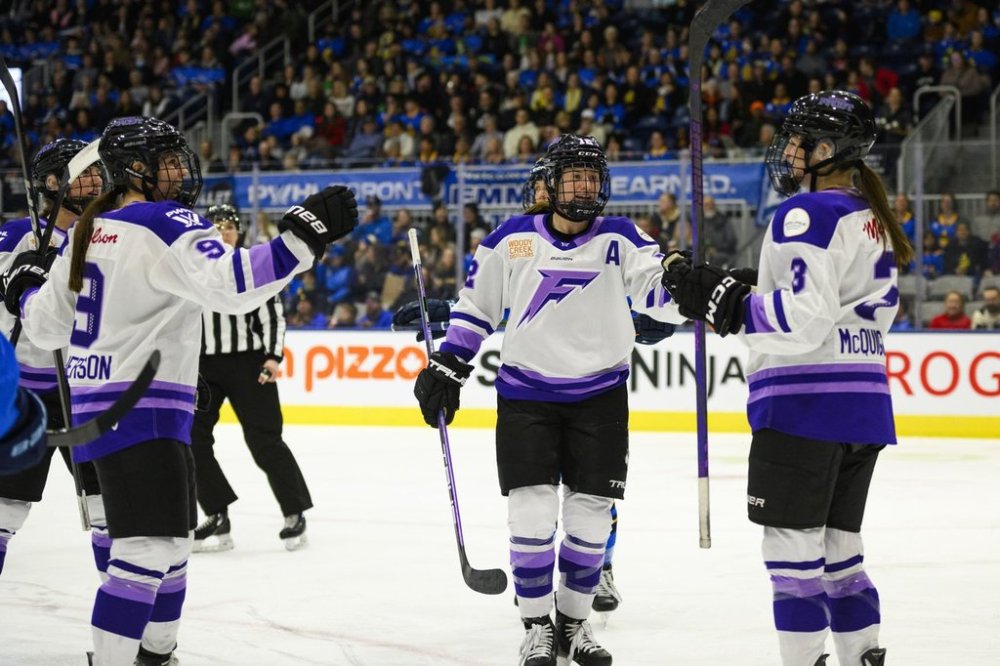Minnesota Frost teammates celebrate with Brooke Mcquigge (13) after she scored on Toronto Sceptres goalie Kristen Campbell, not shown, during first period PWHL hockey action in Toronto on Sunday, March 9, 2025. THE CANADIAN PRESS/Christopher Katsarov