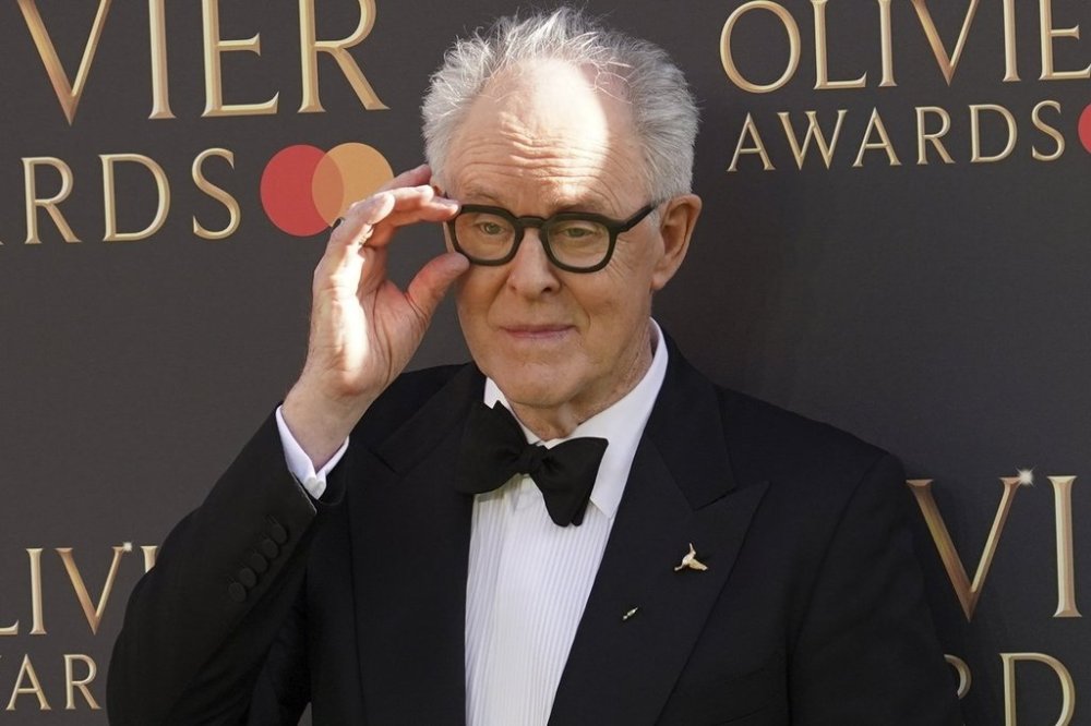 John Lithgow poses for photographers upon arrival at the Olivier Awards on Sunday, April 6, 2025, in London. (Photo by Alberto Pezzali/Invision/AP)