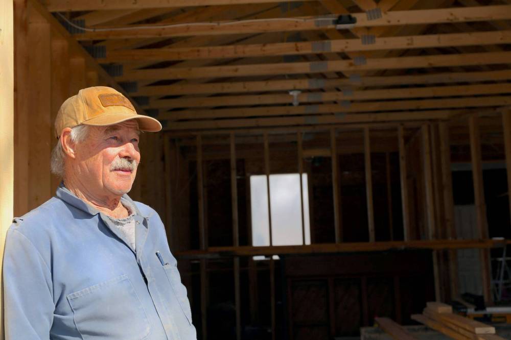 ABOVE: Neil Friesen stands in his newly built garage at the site of an abandoned home in Wawanesa. Friesen plans to remodel the home then put it up for sale, after buying the property for $11,000 at an auction as a retirement project. (Connor McDowell/Brandon Sun)
RIGHT: The back corner of the house is seen before renovations. (Neil Friesen)