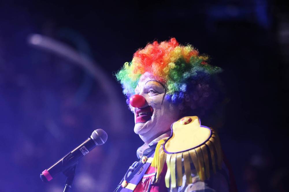 Doodles the Clown walks out into the Keystone Centre amphitheatre into the spotlight and a crowd of screaming kids during his show on Monday afternoon at the Royal Manitoba Winter Fair.