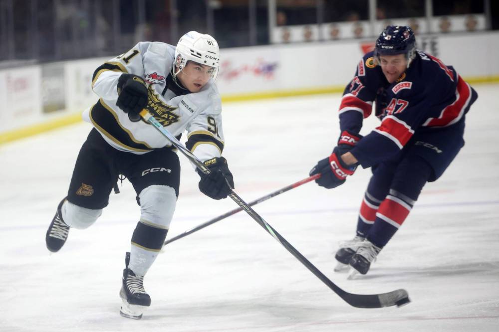 Brandon Wheat Kings forward Nolan Flamand (91) of the fires as shot on net as Regina Pats defenceman Cameron Kuzma (47) tries to cut him off duringa game at Westoba Place in November. (Tim Smith/The Brandon Sun)