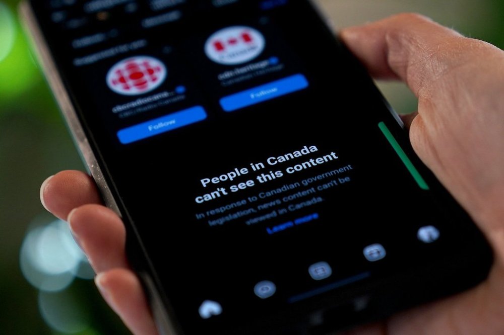 A smartphone showing Meta's blocking of Canadian news content on their Instagram social media app is shown in a photo illustration, in Toronto, Thursday, Aug. 1, 2024. THE CANADIAN PRESS/Giordano Ciampini