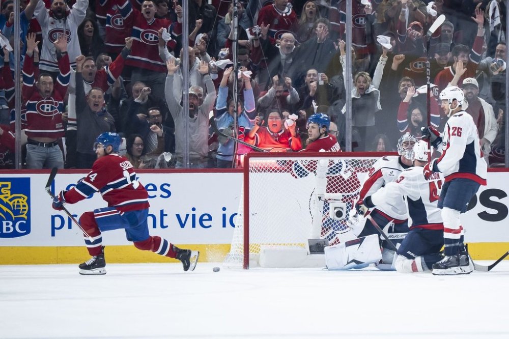 Montreal Canadiens' Nick Suzuki (14) scores on Washington Capitals goaltender Logan Thompson (48) during second period NHL playoff action in Montreal on Friday, April 25, 2025. THE CANADIAN PRESS/Christopher Katsarov