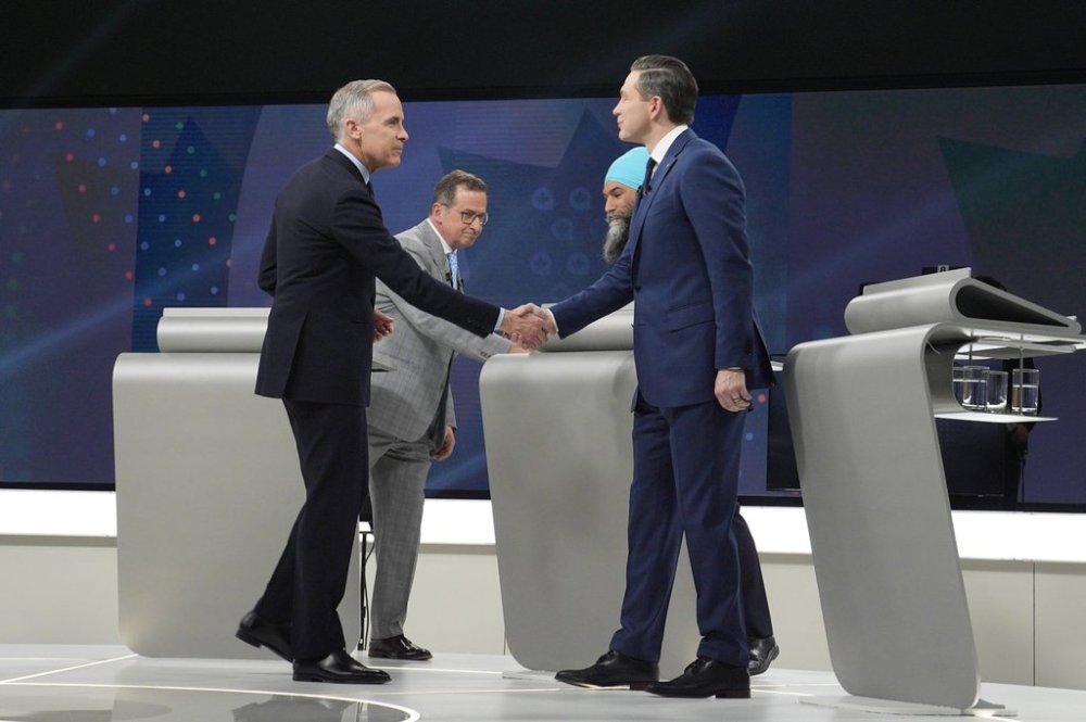Liberal Leader Mark Carney, Conservative Leader Pierre Poilievre, Bloc Quebecois Leader Yves-Francois Blanchet and New Democratic Party Leader Jagmeet Singh shake hands following the French-language federal leaders' debate, in Montreal, Wednesday, April 16, 2025. THE CANADIAN PRESS/Christopher Katsarov