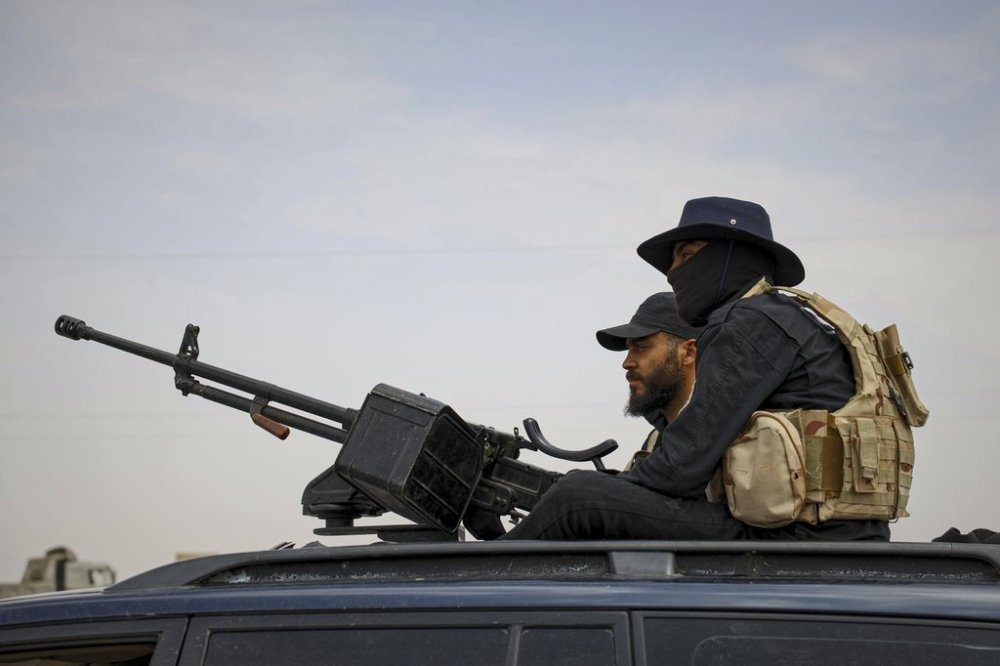 Syria's security forces are deployed at a highway where they found bodies of Syrian Druze fighters who were in a convoy heading from the southern Sweida province towards the capital, at al-Sor al-Kobra village near the Sweida town, southern Syria, Thursday, May 1, 2025. (AP Photo/Omar Albam)