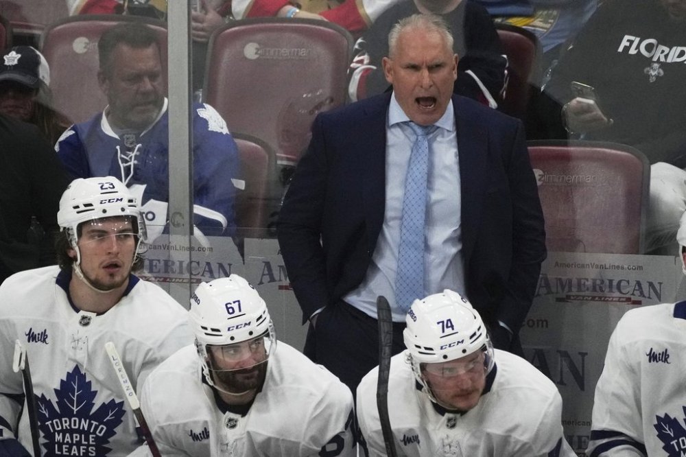 Toronto Maple Leafs head coach Craig Berube is shown during overtime of Game 3 against the Florida Panthers on Friday, May 9, 2025, in Sunrise, Fla. (AP Photo/Marta Lavandier)