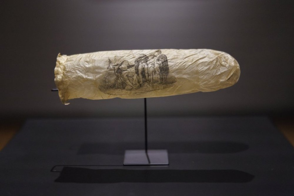 EDS NOTE: NUDITY - This image made available by the Rijksmueum shows a condom with print, circa 1830, which has gone on display at Amsterdam's Rijksmuseum. (Kelly Schenk/Rijksmuseum via AP)