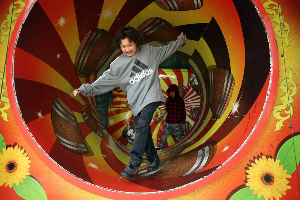 Harlon Leask manoeuvres his way through the Cuckoo Haus on the midway during last year’s Manitoba Summer Fair at the Keystone Centre. The Summer Fair returns to Brandon June 4-8. (Tim Smith/The Brandon Sun)