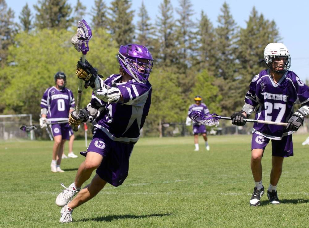 Vincent Massey’s Ryan Thevenot cradles the ball against the Springfield Sabres during their Manitoba High School Field Lacrosse game at Massey on Sunday. (Thomas Friesen/The Brandon Sun)