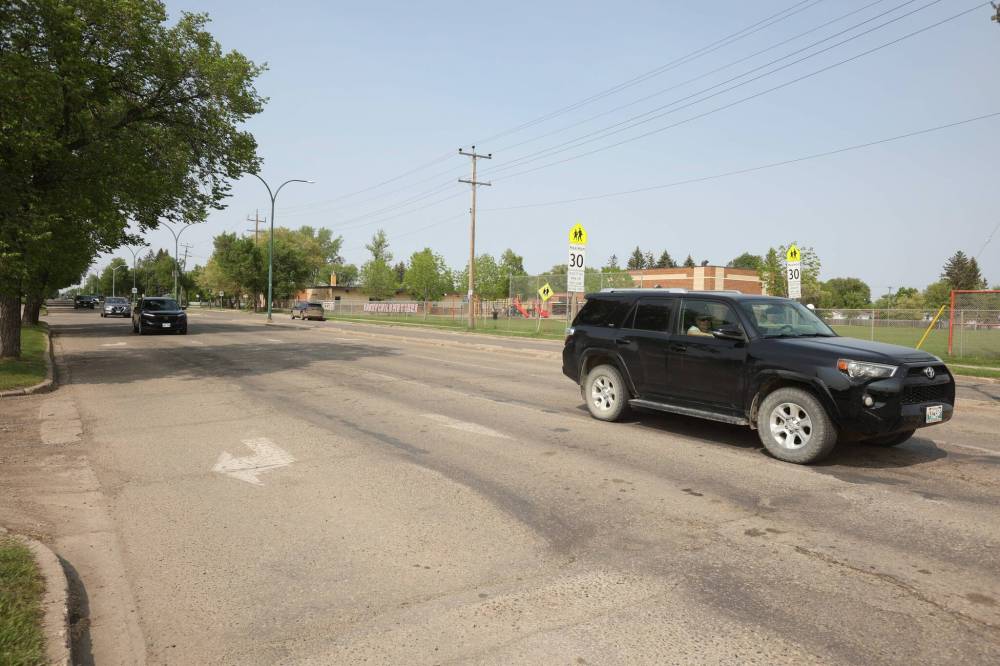 Vehicles drive along 26th Street near Park Avenue in Brandon on Thursday afternoon. The street was voted sixth worst in the province in CAA Manitoba's 10 Worst Roads survey. (Tim Smith/The Brandon Sun)