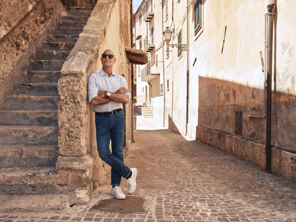 This image released by National Geographic shows Stanley Tucci posing in the Abruzzo region of Italy during the filming of his series