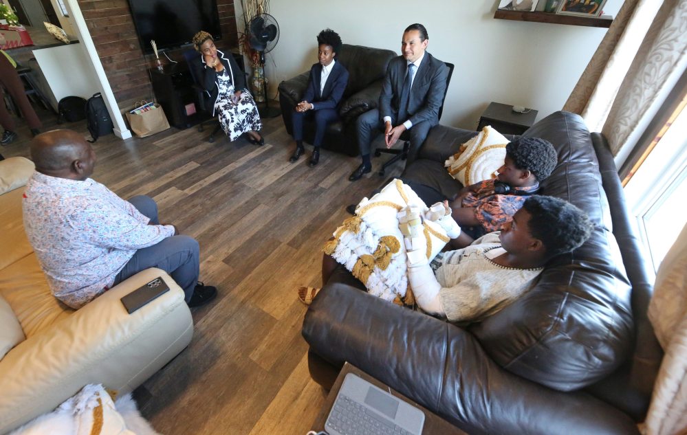 Asagwara and Kinew speak with the Onuke family in their home near Sprucewoods on Thursday afternoon. (Matt Goerzen/The Brandon Sun)