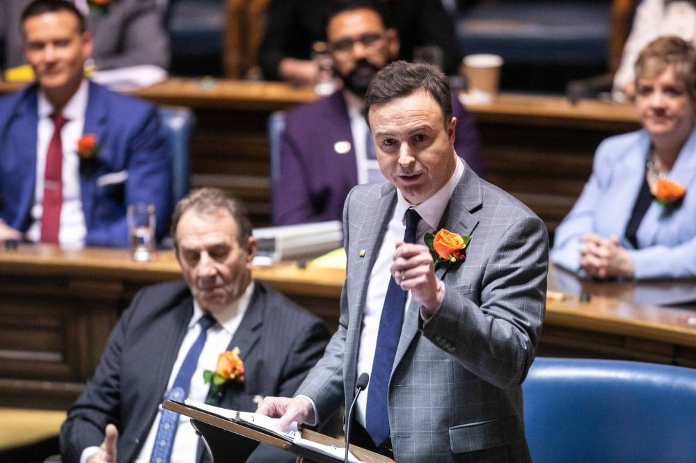 MIKAELA MACKENZIE / FREE PRESS 	 Finance minister Adrien Sala reads the budget speech in the legislative chamber at the Manitoba Legislative Building on Thursday, March 20, 2025. For budget stories. Winnipeg Free Press 2025