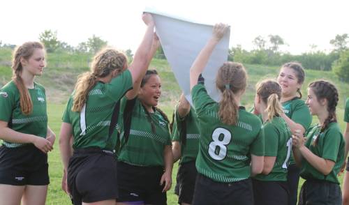 The Dauphin Clippers girls rugby team celebrate their provincial championship after they beat the Souris Sabres on Monday in Brandon. The sport is taking off in Dauphin, with Mavs Fest being held today in the city. (Perry Bergson/The Brandon Sun)