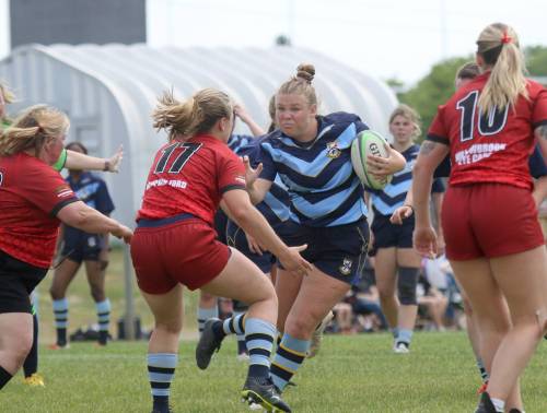 Brandon Barbarians hooker Beth Couling takes on a Dauphin Mavericks defending during their women&rsquo;s rugby game at John Reilly Field on Saturday. (Thomas Friesen/The Brandon Sun)