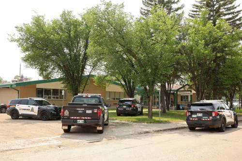 Several Brandon Police Service vehicles sit parked outside École Secondaire Neelin High School on June 10. Brandon Police Service members responded to a serious incident at the school after a student was seriously injured with a weapon. The school was placed in lockdown and students were released to the custody of parents, relatives and guardians. 
(Tim Smith/The Brandon Sun files)