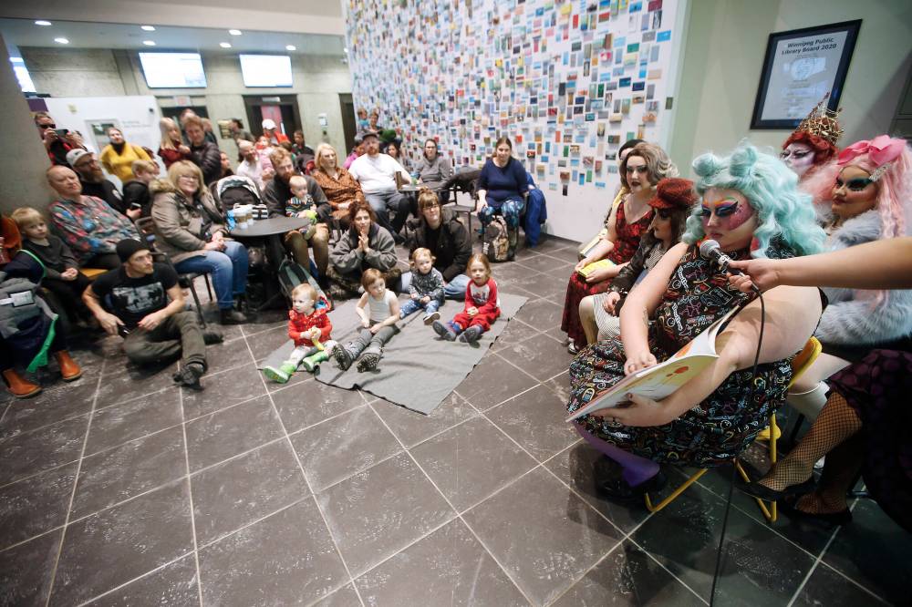 Drag queens and kings read story books to children in the lobby of the Millennium Library in Winnipeg in February 2020. (John Woods/Winnipeg Free Press files)