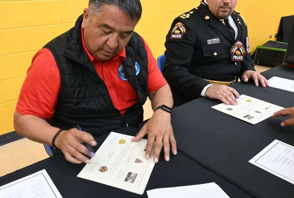 Dakota Plains Wahpeton Nation Chief Donny Smoke is seen during a signing ceremony in June to transfer policing responsibilities to the Manitoba First Nations Police Service. (Manitoba First Nations Police Service/Facebook)