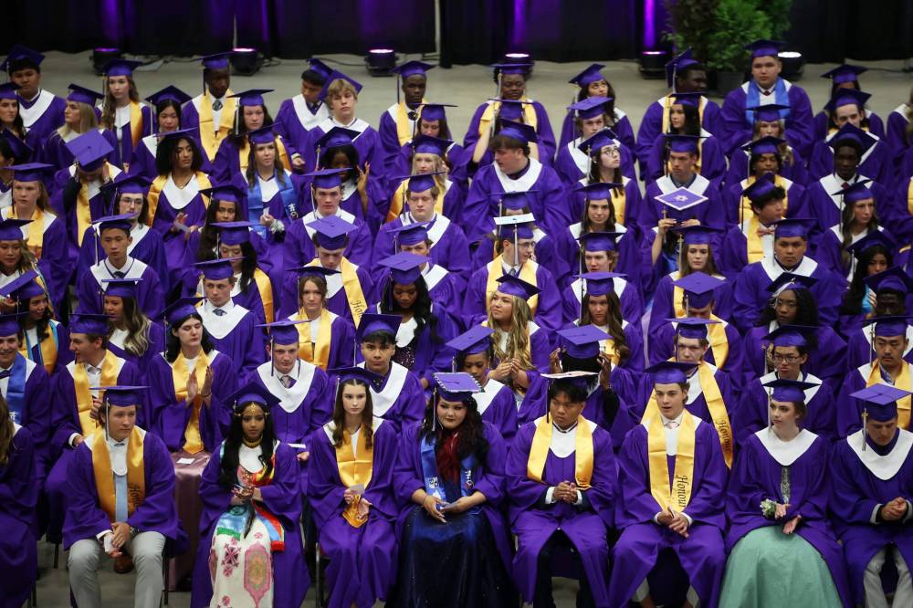Graduates look out at their loved ones, friends and supporters during Vincent Massey High School’s 2025 graduation ceremony at Westoba Place on Monday. (Tim Smith/The Brandon Sun)