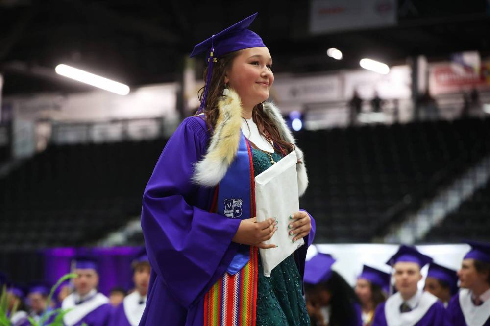 Grade 12 graduate Cali Ferland walks across the stage after receiving her diploma. (Tim Smith/The Brandon Sun)
