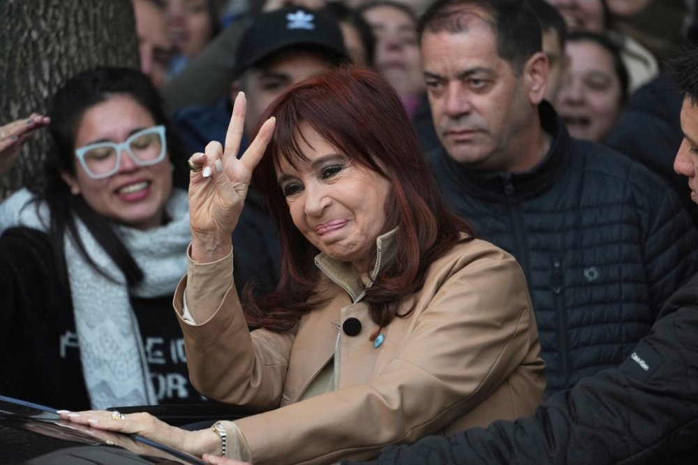 Argentina's former President Cristina Fernandez greets supporters as she leaves her home in Buenos Aires, Argentina, Tuesday, June 10, 2025. (AP Photo/Rodrigo Abd)