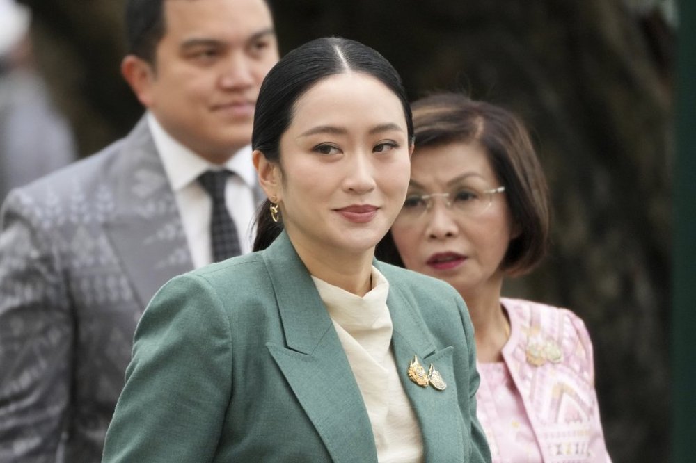 Thailand's Prime Minister Paetongtarn Shinawatra arrives at Government House for a cabinet meeting in Bangkok, Thailand, Tuesday, July 1, 2025. (AP Photo/Sakchai Lalit)