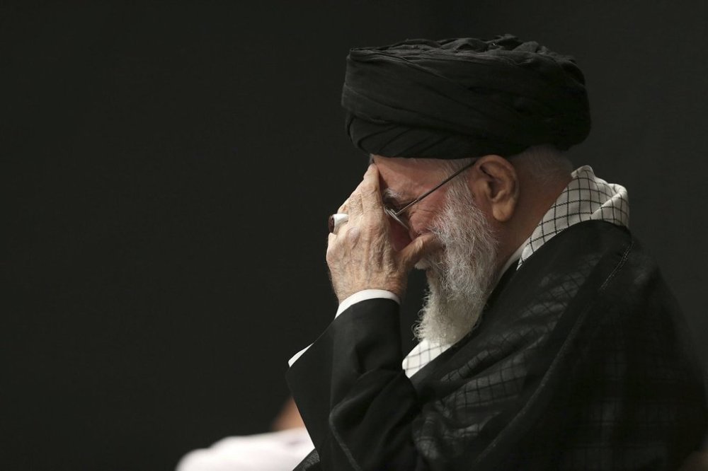 In this photo provided by the Office of the Iranian Supreme Leader, Supreme Leader Ayatollah Ali Khamenei attends a mourning ceremony commemorating the death anniversary of the Prophet Muhammad's grandson, Hussein, in Tehran, Iran, on Saturday, July 6, 2025. (Office of the Iranian Supreme Leader via AP)