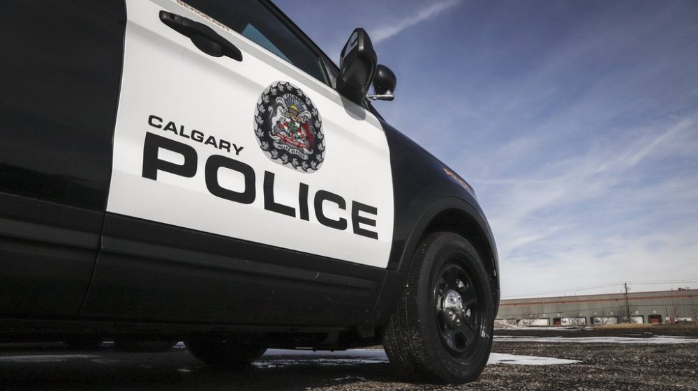 A police vehicle at Calgary Police Service headquarters is shown in this photo from Thursday, April 9, 2020. Police in Calgary are investigating after the equipment set up for an outdoor pop-up Nigerian market collapsed over the weekend and struck eight people. THE CANADIAN PRESS/Jeff McIntosh