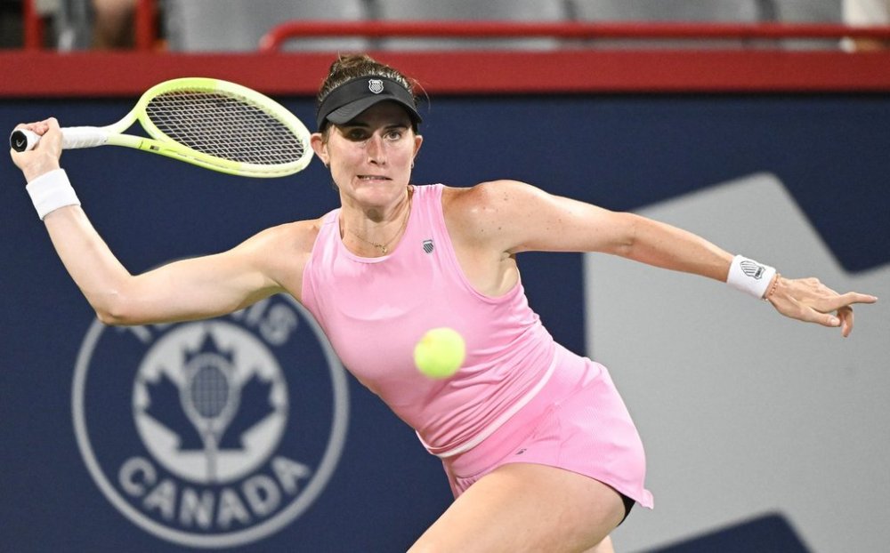 Rebecca Marino, of Canada, keeps her eyes on the ball during her first round match against Elsa Jacquemot, of France, at the National Bank Open tennis tournament in Montreal, Sunday, July 27, 2025. THE CANADIAN PRESS/Graham Hughes