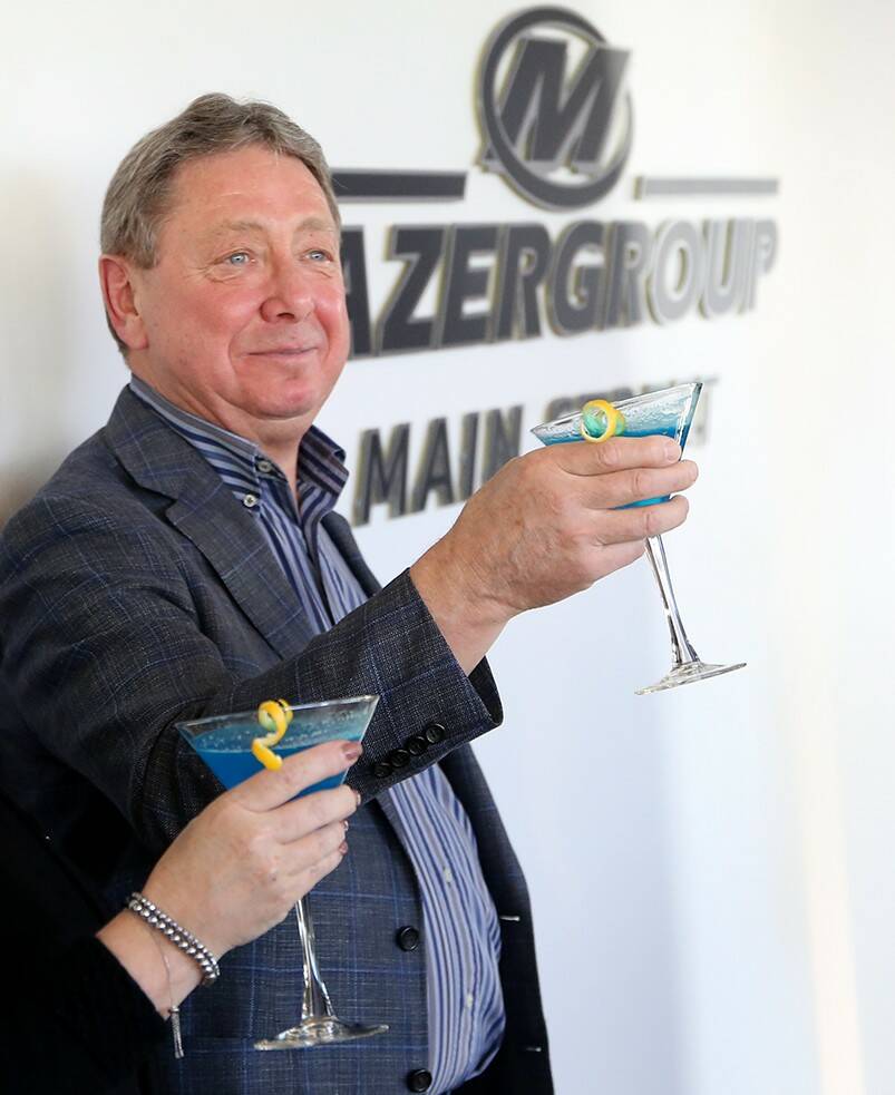 Mazergroup president and CEO Bob Mazer makes a toast in honour of Assiniboine Community College naming a portion of the Len Evans Centre for Trades and Technology after his company in 2022. Mazer passed away Sunday at the age of 75. (Ian Hitchen/The Brandon Sun files)