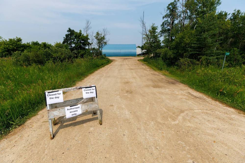 Signs indicate the closure of Harv's Air flight school just north of where the planes crashed south of Steinbach on Tuesday. (Mike Deal/Winnipeg Free Press)