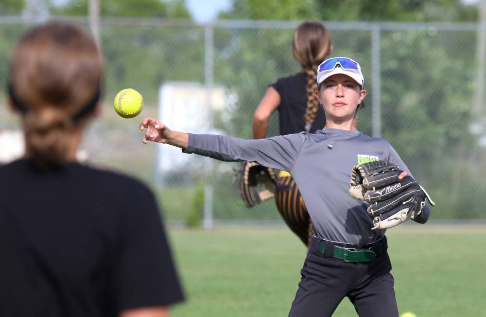 Westman Magic U13 catcher Ayven Chuchmuch warms up during the team’s last practice before AAA softball provincials, beginning Thursday in Friedensfeld. (Thomas Friesen/The Brandon Sun)