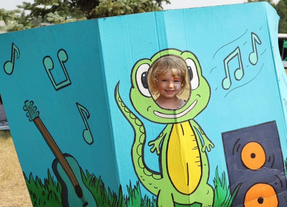 A young girl enjoys the salamander cutout during this year’s festival.