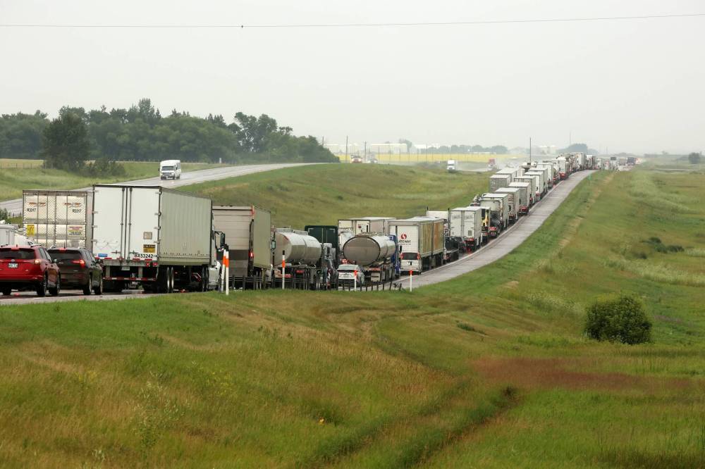 Eastbound traffic on the Trans-Canada Highway is backed up on Tuesday morning after a serious collision between a semi-trailer and another vehicle. (Tim Smith/The Brandon Sun)