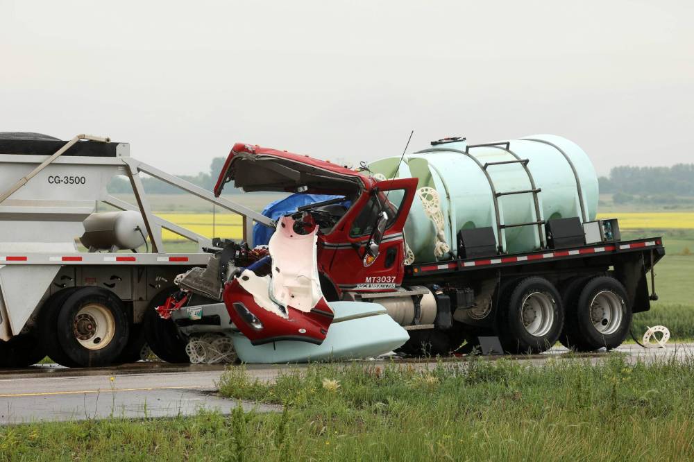 A truck's front end sustained heavy damage in a collision with a semi-trailer on the Trans-Canada Highway on Tuesday morning. (Tim Smith/The Brandon Sun)