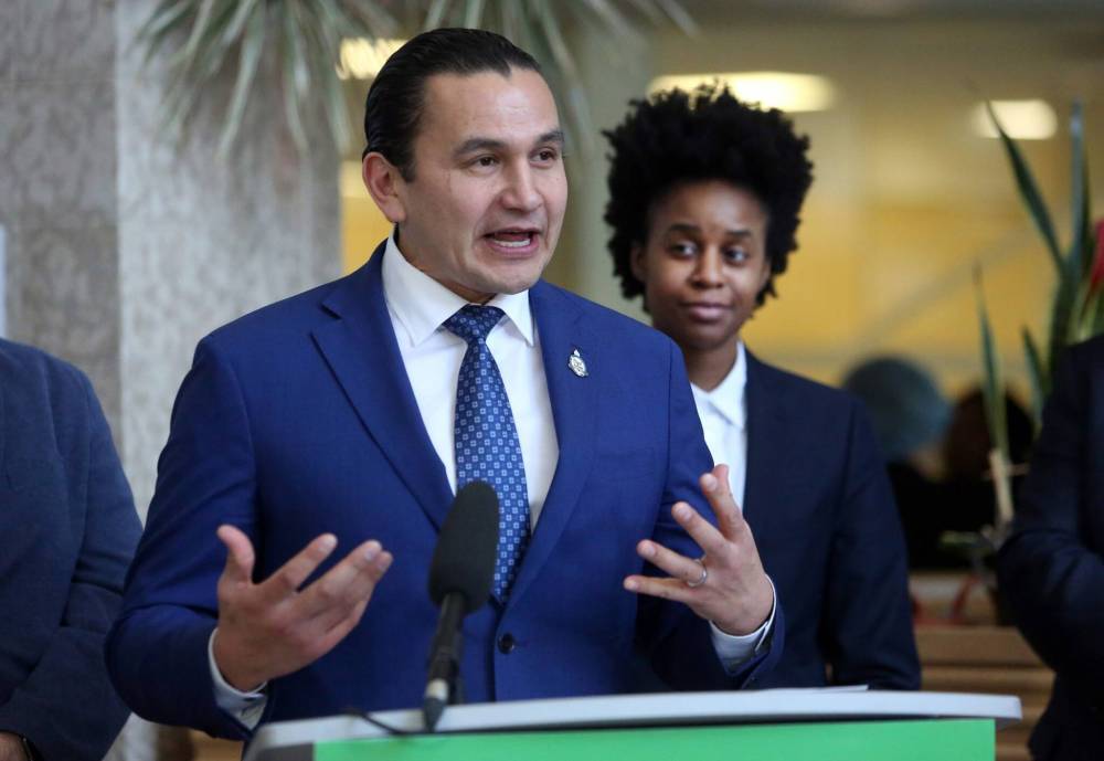 Health Minister Uzoma Asagwara listens to Premier Wab Kinew speak inside the atrium at the Brandon Regional Health Centre last year. Tom Brodbeck writes that while Kinew and the NDP made it clear that fixing the province’s health-care system wouldn’t happen overnight once they took power in the fall of 2023, “nobody expected things to get worse.” (Matt Goerzen/The Brandon Sun files)