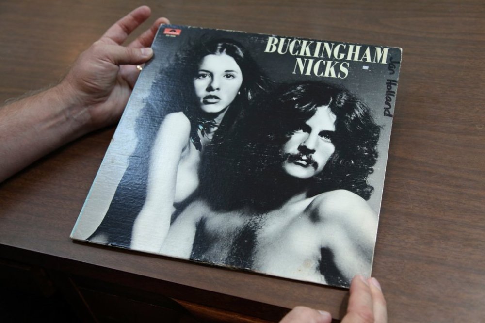 Music historian and journalist Brian Mansfield holds an original pressing of the