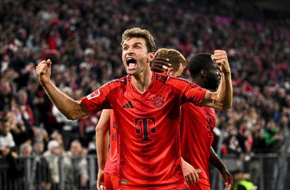 FILE - Munich's Thomas Muller celebrates a 1-0 win in a German Bundesliga soccer match between FC Bayern Munich and VfB Stuttgart, in Munich, Germany, Saturday, Oct. 19, 2024. (Tom Weller/dpa via AP, File)