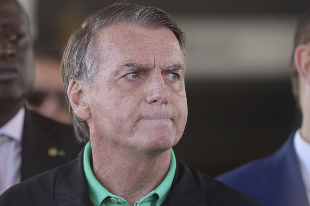Brazil's former President Jair Bolsonaro gives a press conference outside the Senate in Brasilia, Brazil, Thursday, July 17, 2025. (AP Photo/Luis Nova)