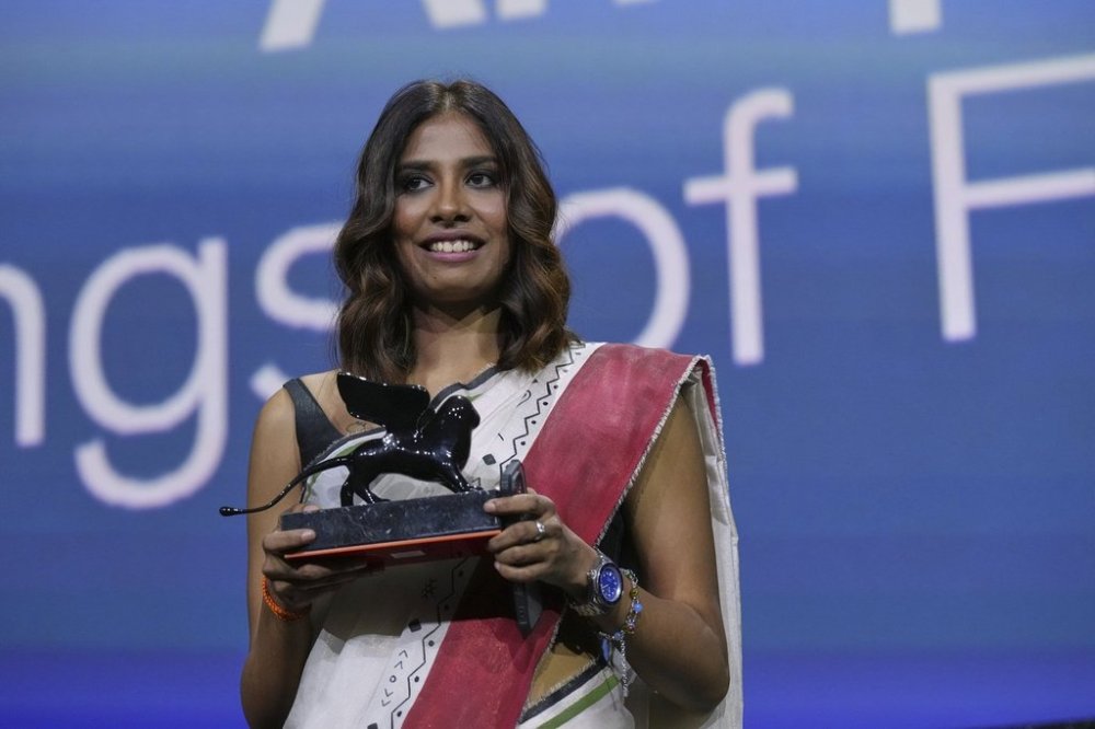 Anuparna Roy accepts the Orizzonti best director award for 'Songs of the Forgotten Trees' during the awards ceremony of the 82nd edition of the Venice Film Festival in Venice, Italy, on Saturday, Sept. 6, 2025. (Photo by Alessandra Tarantino/Invision/AP)