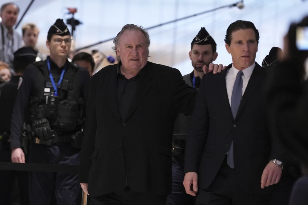 FILE - Actor Gerard Depardieu arrives with his lawyer Jeremie Assous, right, to face trial for the alleged sexual assaults of two women on a film set in 2021, Monday, March 24, 2025 in Paris. (AP Photo/Aurelien Morissard, file)