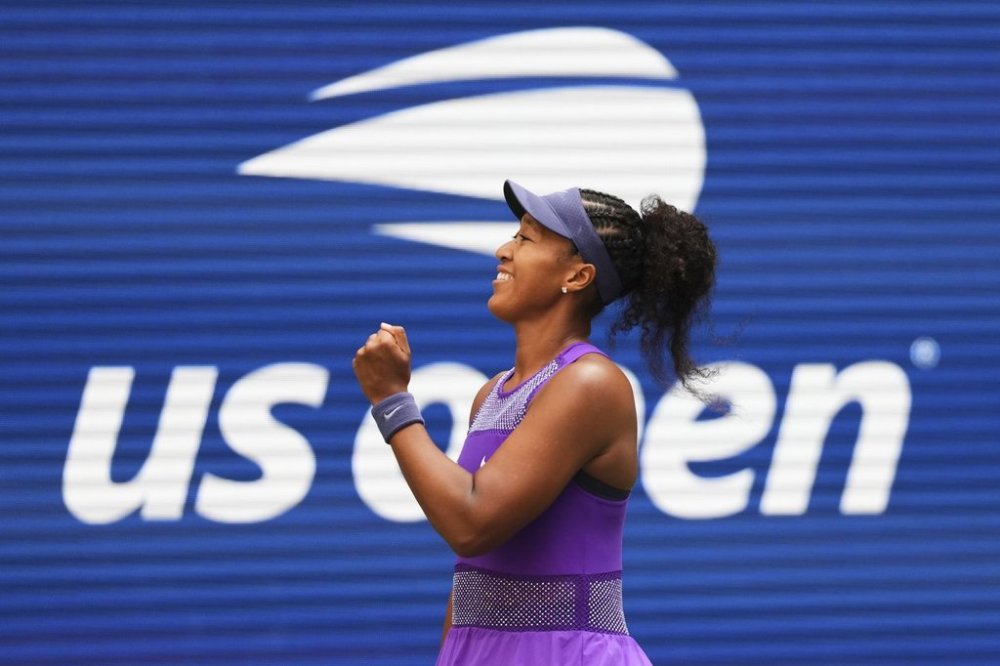 Naomi Osaka, of Japan, celebrates after winning a match against Coco Gauff, of the United States, during the fourth round of the US Open tennis championships, Monday, Sept. 1, 2025, in New York. (AP Photo/Kirsty Wigglesworth)