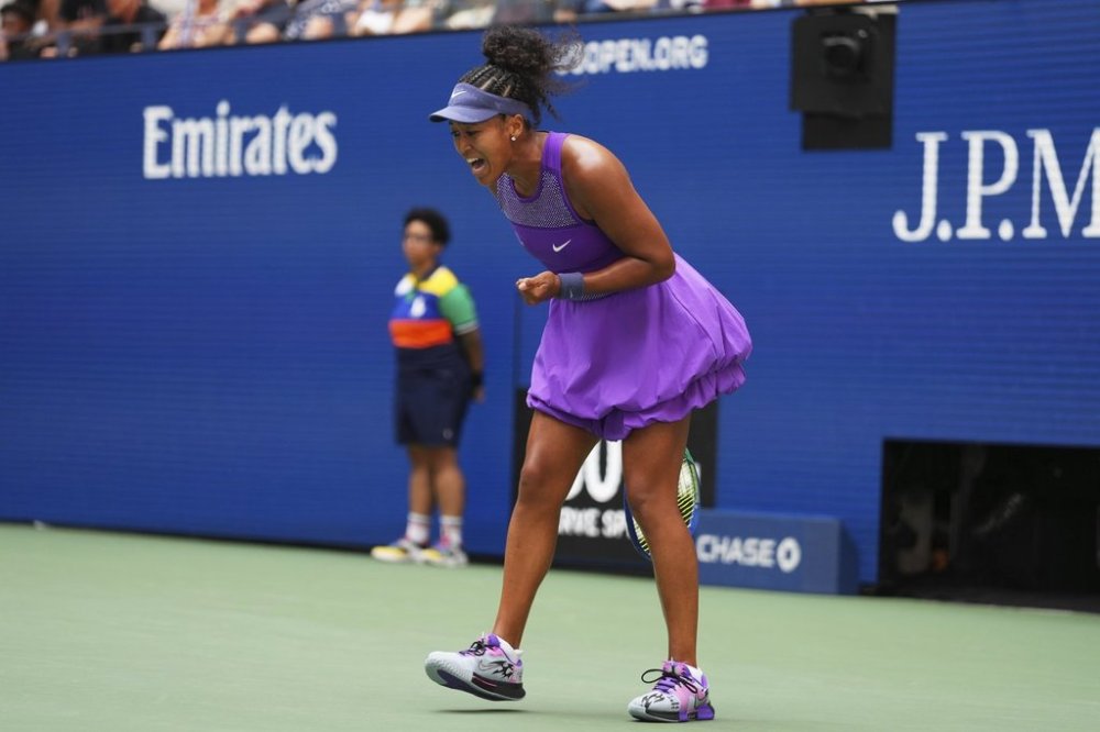 Naomi Osaka, of Japan, reacts during a match against Coco Gauff, of the United States, in the fourth round of the US Open tennis championships, Monday, Sept. 1, 2025, in New York. (AP Photo/Kirsty Wigglesworth)
