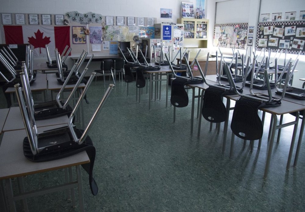 An empty classroom is pictured at Eric Hamber Secondary school in Vancouver, Monday, March 23, 2020. THE CANADIAN PRESS/Jonathan Hayward