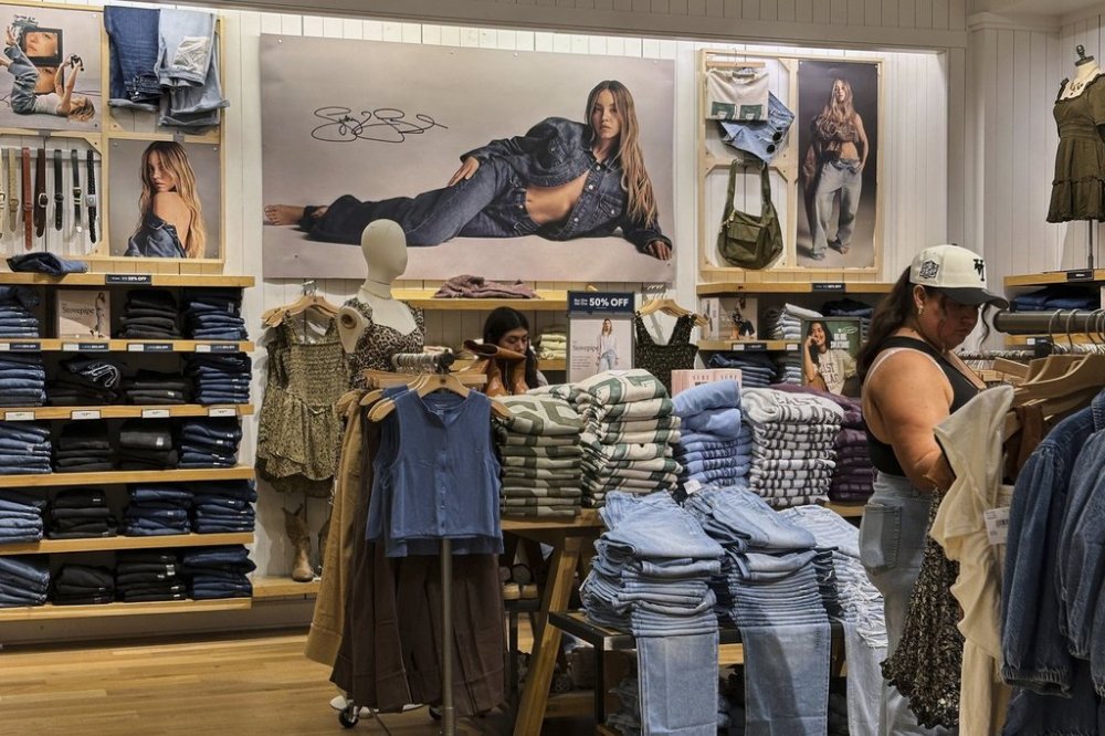 A Sydney Sweeney jeans ad is seen as shoppers browse at an American Eagle Outfitters, Thursday, Sept. 4, 2025, in Bellevue, Wash. (AP Photo/Lindsey Wasson)