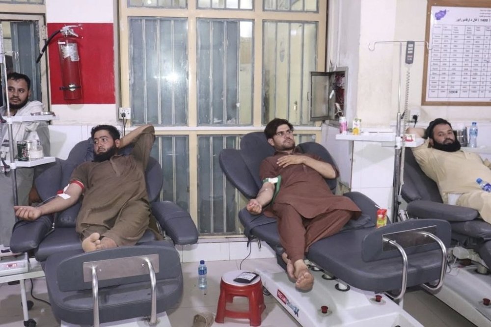 In this photo released by the Ministry of Public Health, Afghans donate blood for victims of an earthquake that killed hundreds and destroyed numerous villages in eastern Afghanistan, at Nangarhar Regional Hospital in Nangarhar, Monday, Sept. 1, 2025. (Afghanistan Ministry of Public Health via AP)